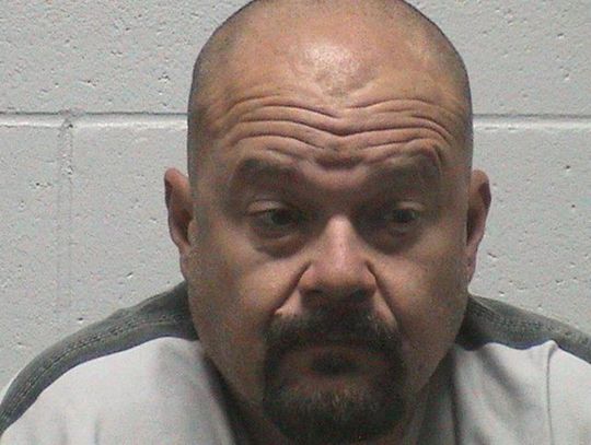 Man charged with threatening to run over school district employee
