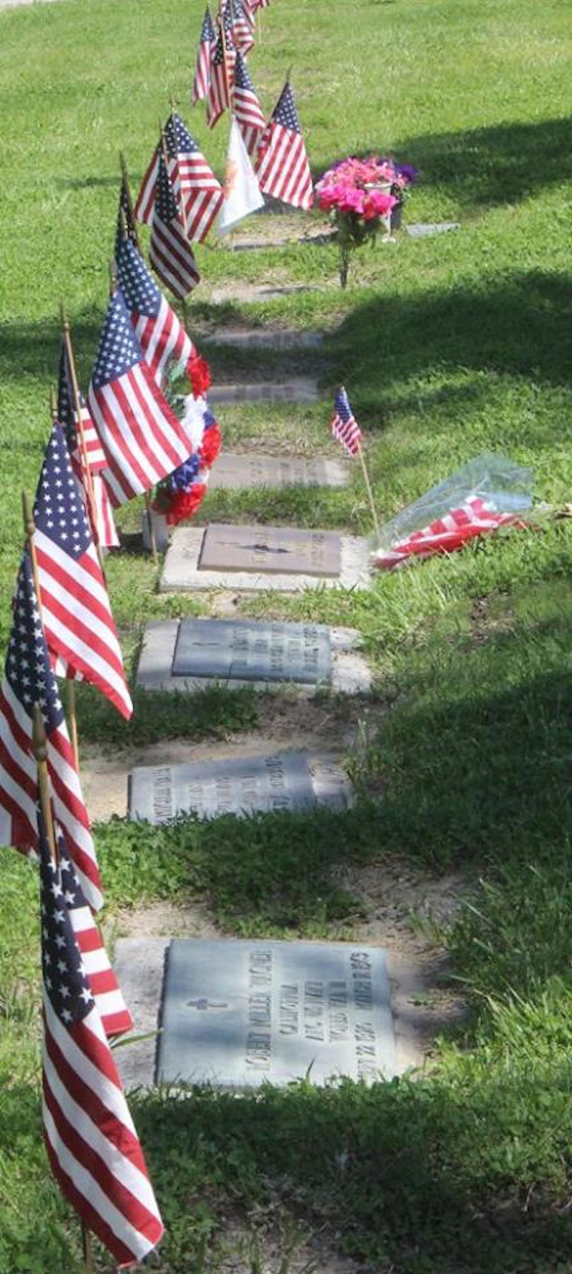 Flag Placement Day following social distancing guidelines at veterans cemeteries