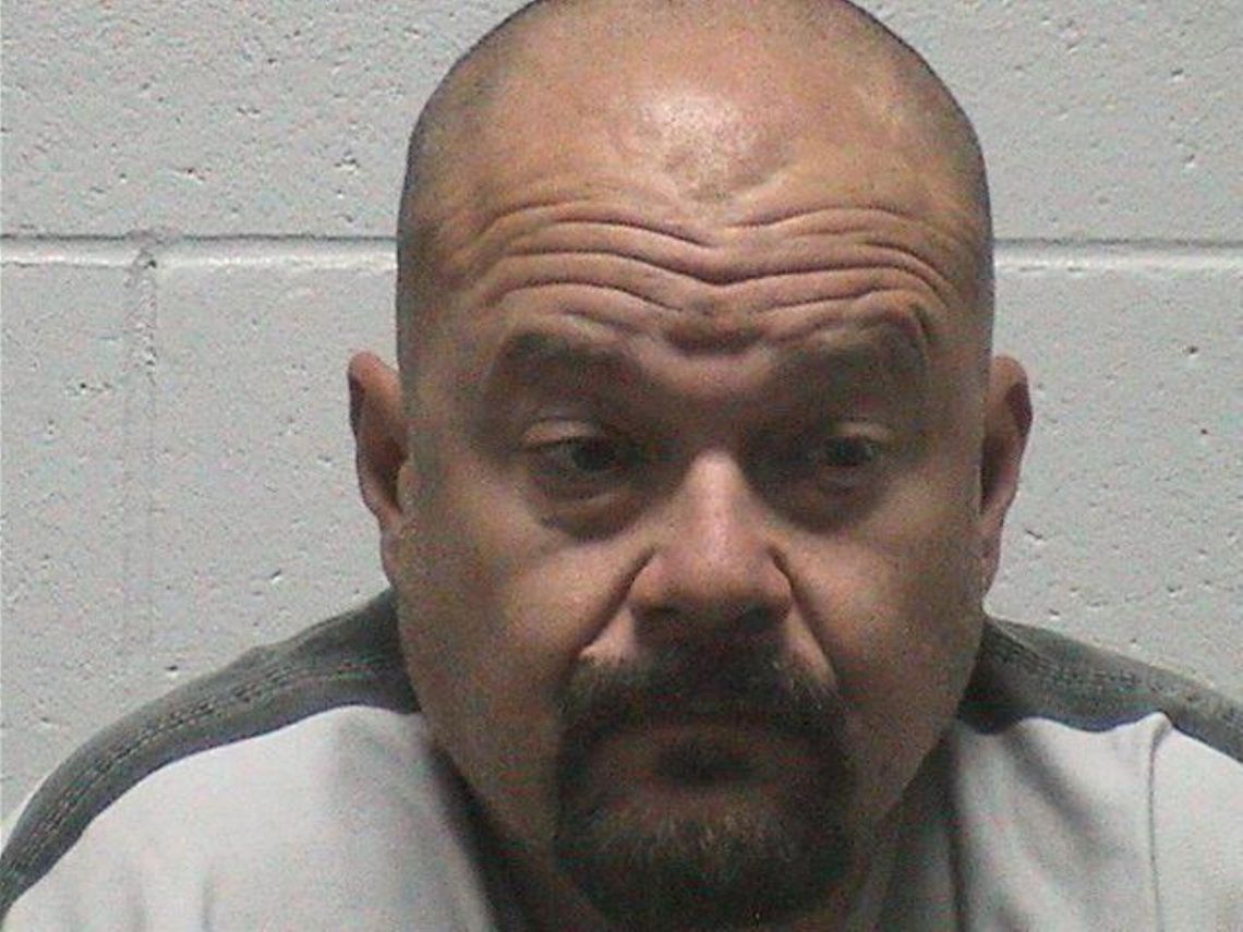 Man charged with threatening to run over school district employee