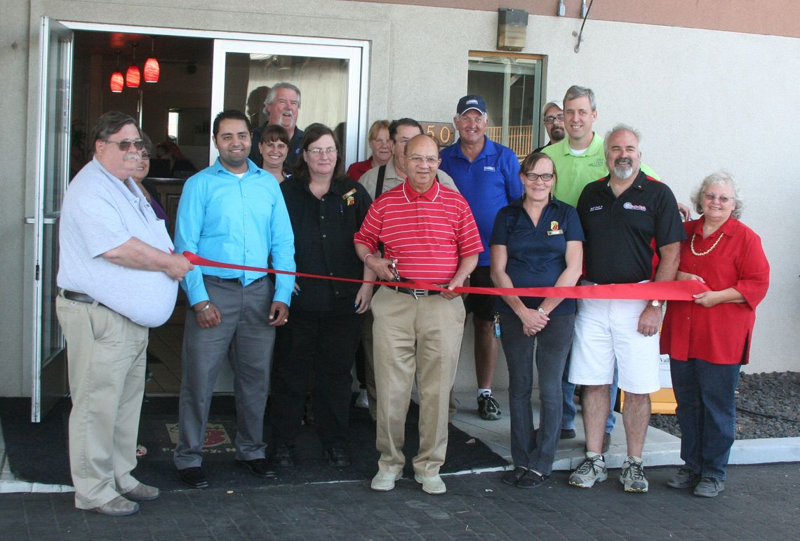 New Super 8 owners celebrate ribbon cutting