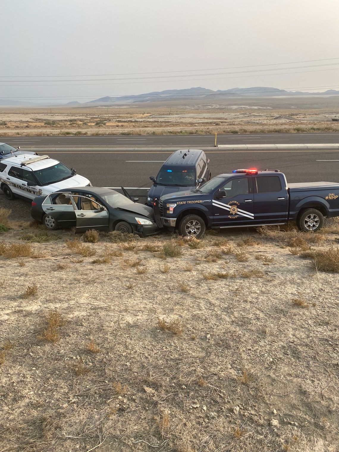 NHP says driver in pursuit tried to run over NDOT workers