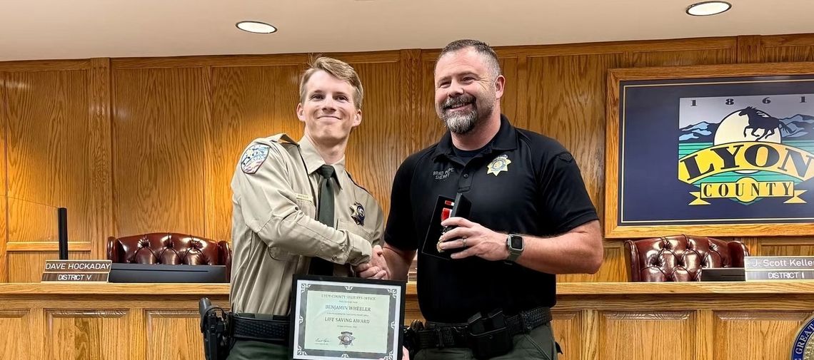 Deputy Benjamin Wheeler received an award from Sheriff Brad Pope.